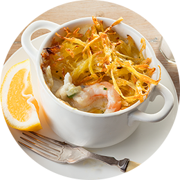 Tarte aux fruits de mer garnie de pommes de terre