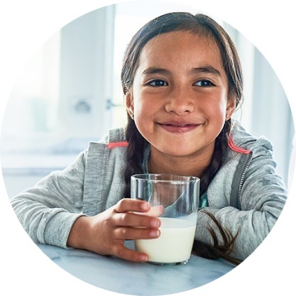 Young girl drinking milk