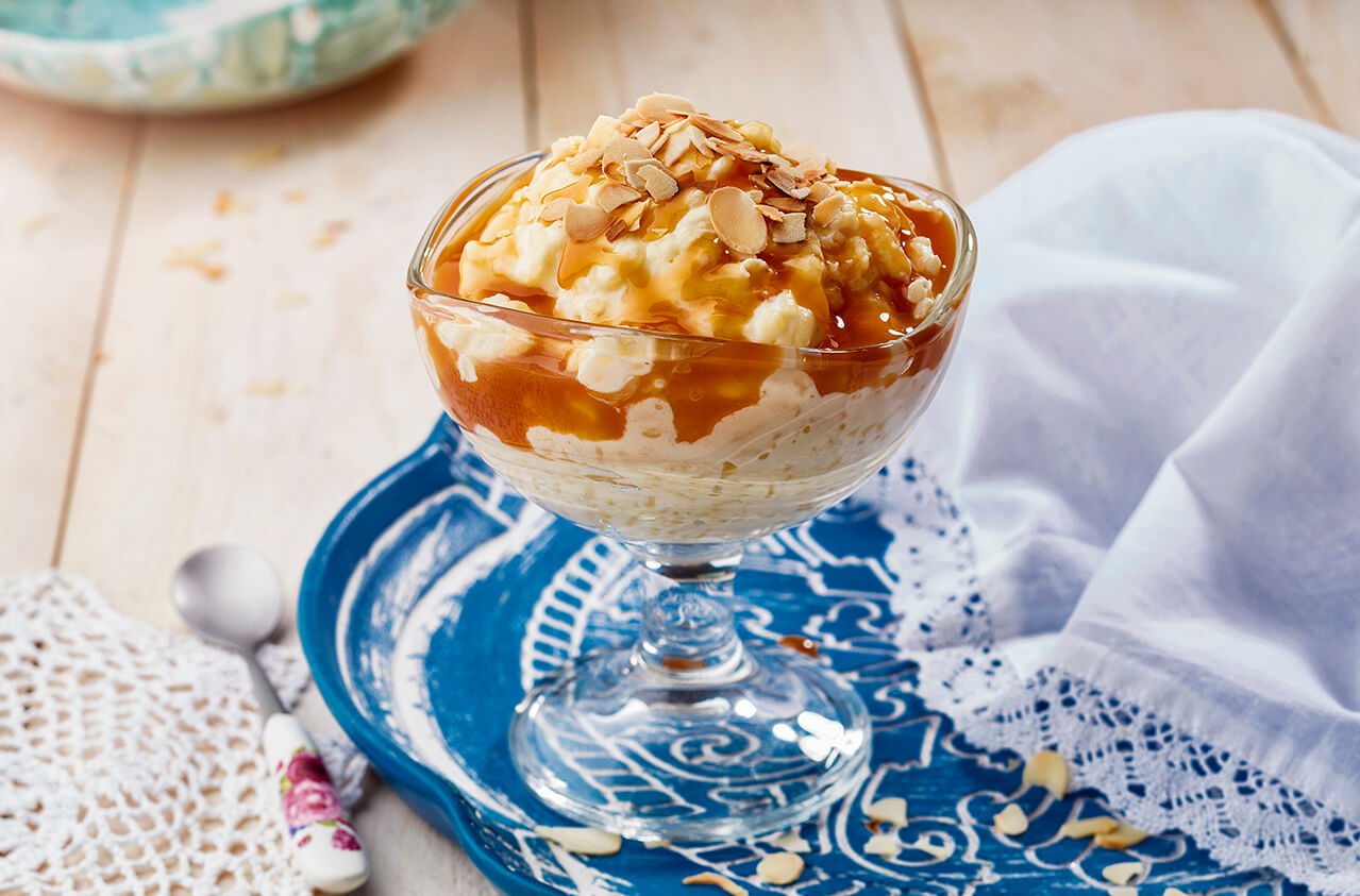 Salted caramel milky rice pudding with almond sprinkle