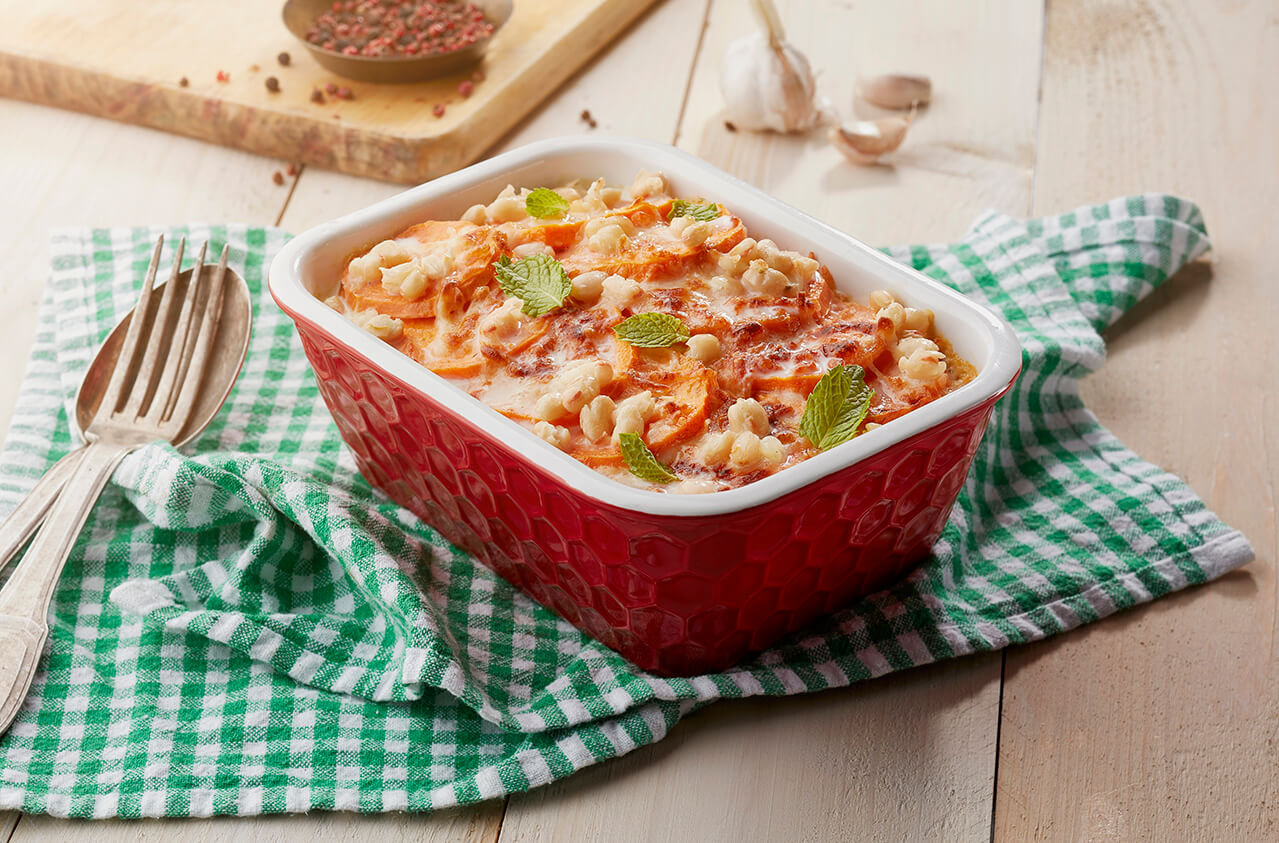 Sweet potatoes bake in béchamel sauce with white beans & mint