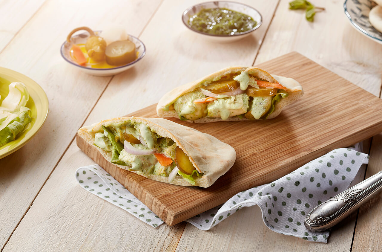 Pesto chicken cheese pocket sandwich with Arabic pickles
