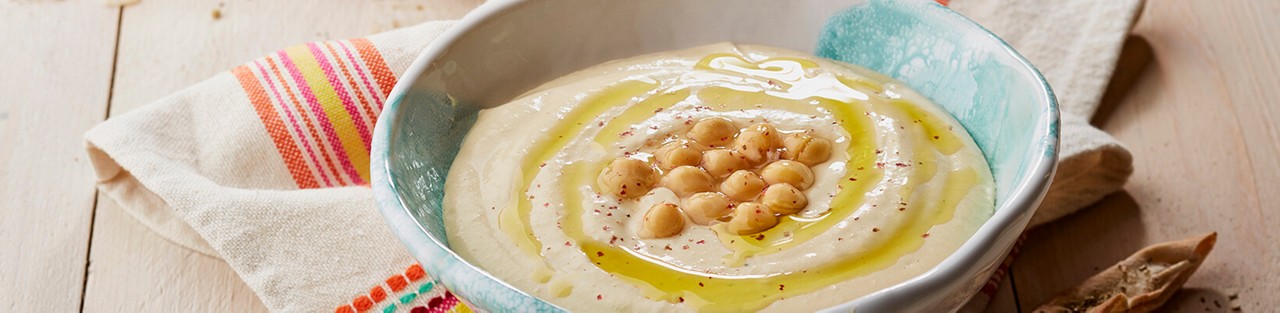 Cheese hummus dip with roasted Arabic salty bread sticks