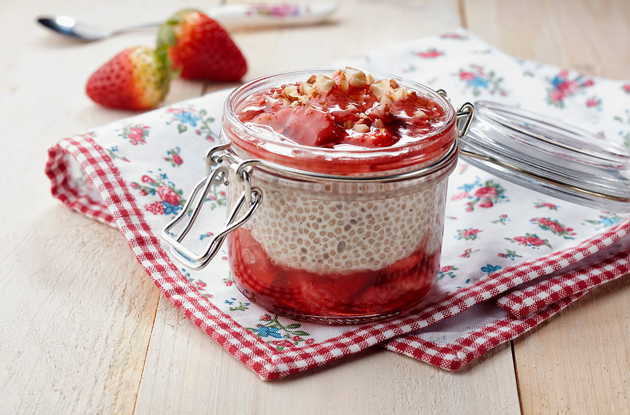 Chia milky pudding with homemade strawberry compote and pistachio dust