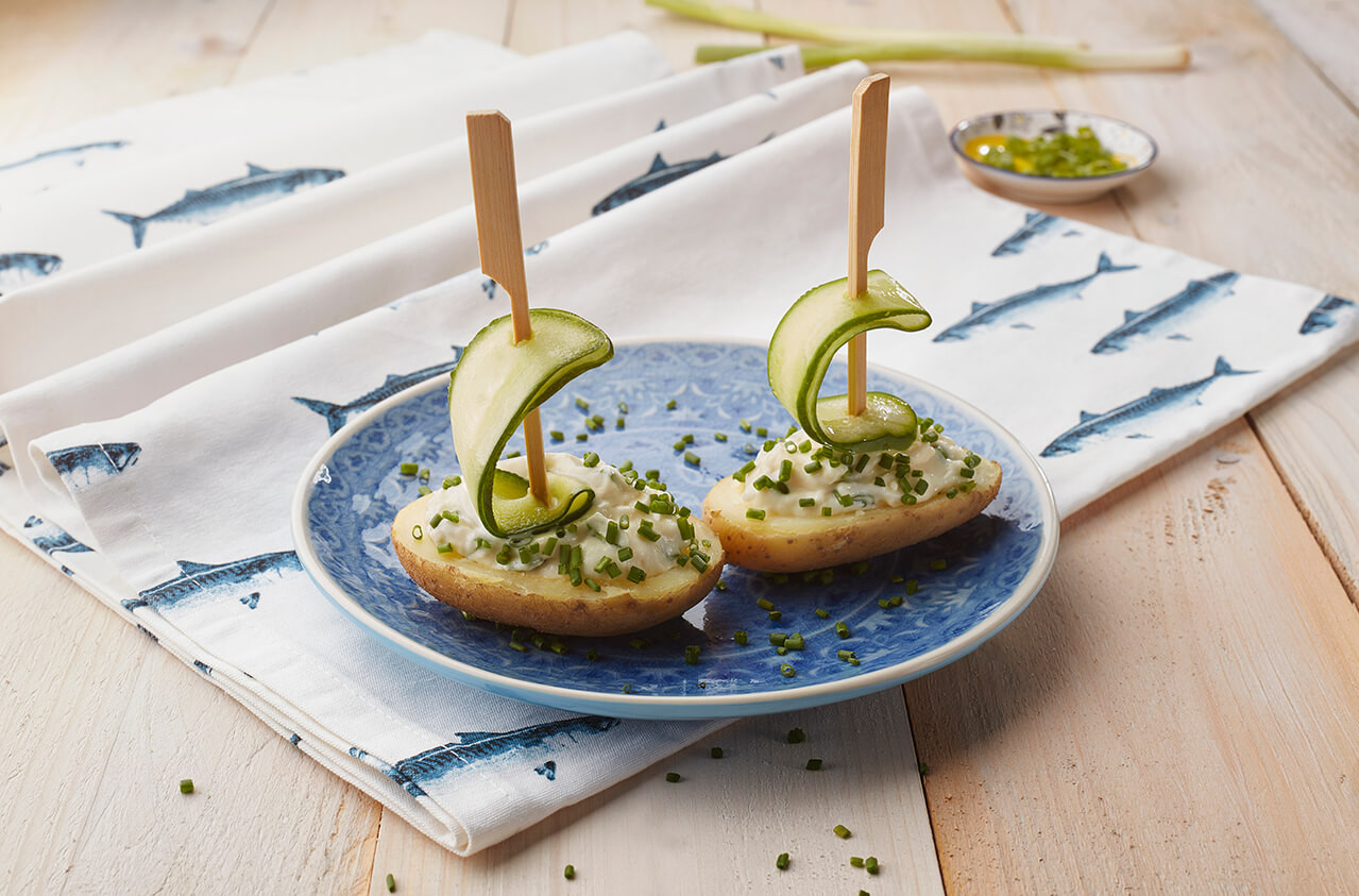 Potato cheese boats with cucumber mast and chives