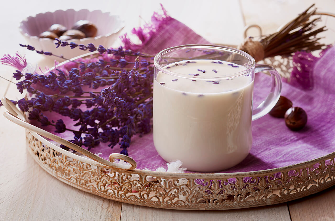 Ginger, lavender, nutmeg hot milk in a pot